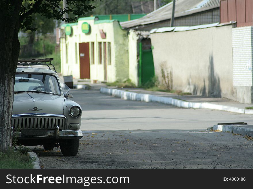 The old thrown car on the street