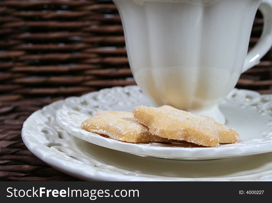 Cup and saucer with star shaped biscuits