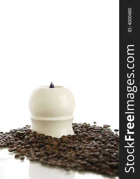 Coffee beans with candle on white background. Coffee beans with candle on white background