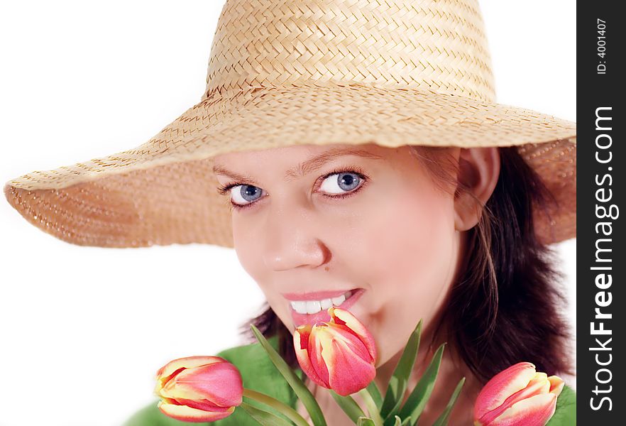 Young woman with strawhat and a bunch of tulips,isolated on white. Young woman with strawhat and a bunch of tulips,isolated on white