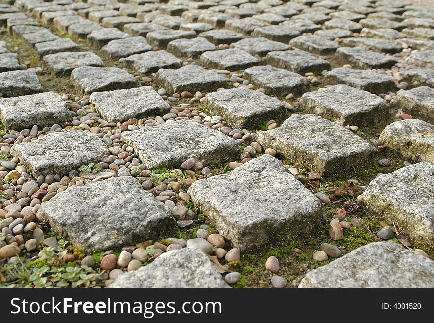 Stone block paving perspective with pebbles
