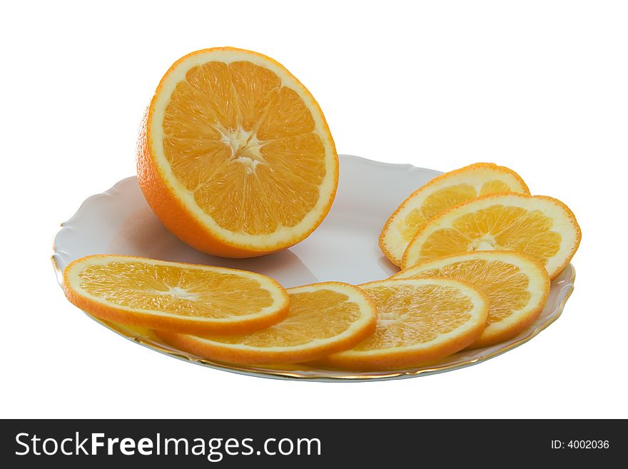 Orange juicy slices on a plate isolated on white. Orange juicy slices on a plate isolated on white