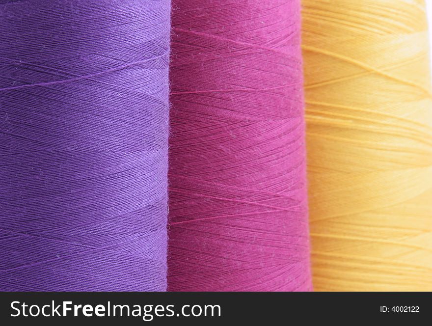 Colored Spools Of Thread Close-up Isolated