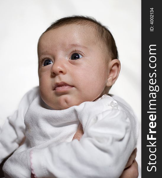 3 month old baby against a white background