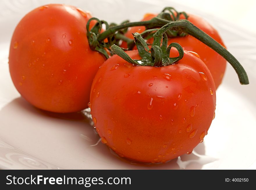 Fresh Red Tomatoes On White Plate
