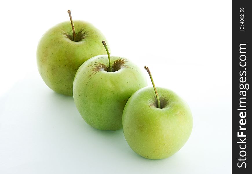 Three green apples isolated on white