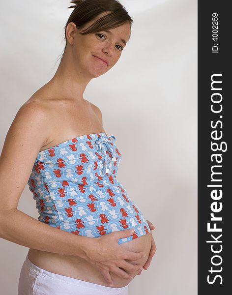 Pregnant girl against white background 1