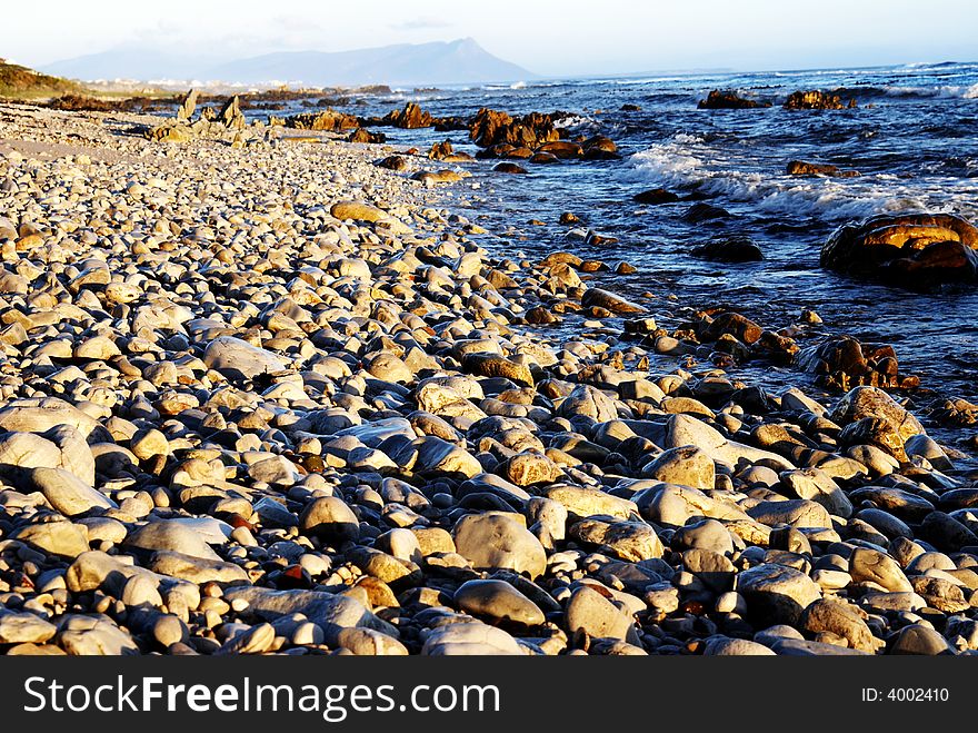 Rocky beach at sunset