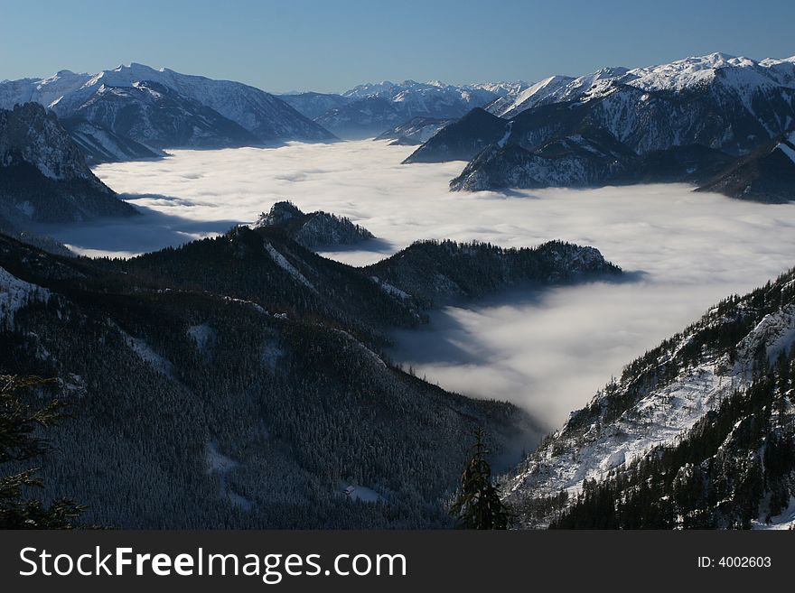 Mountain valley covered with fog
