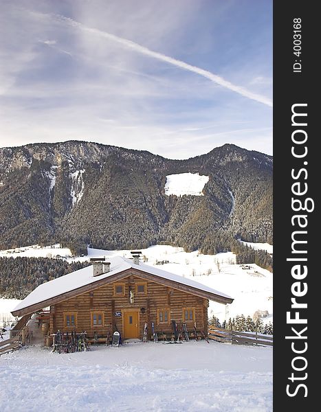 Skiing area in Soell (Austria), general view from the track with a wooden house