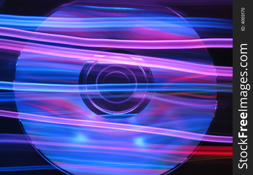 CD with light streaming across it. CD with light streaming across it