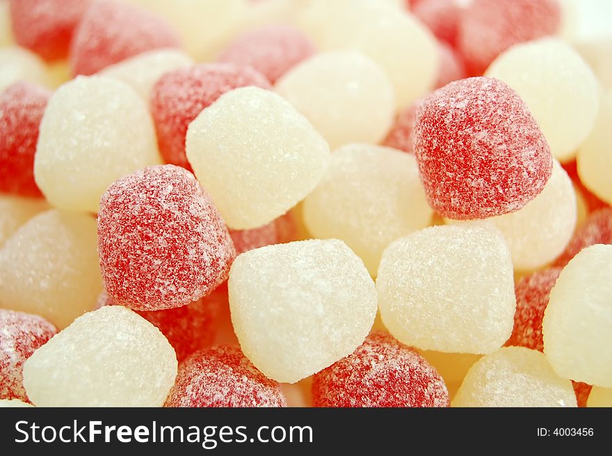 Brightly colored valentine candies on a white background. Brightly colored valentine candies on a white background