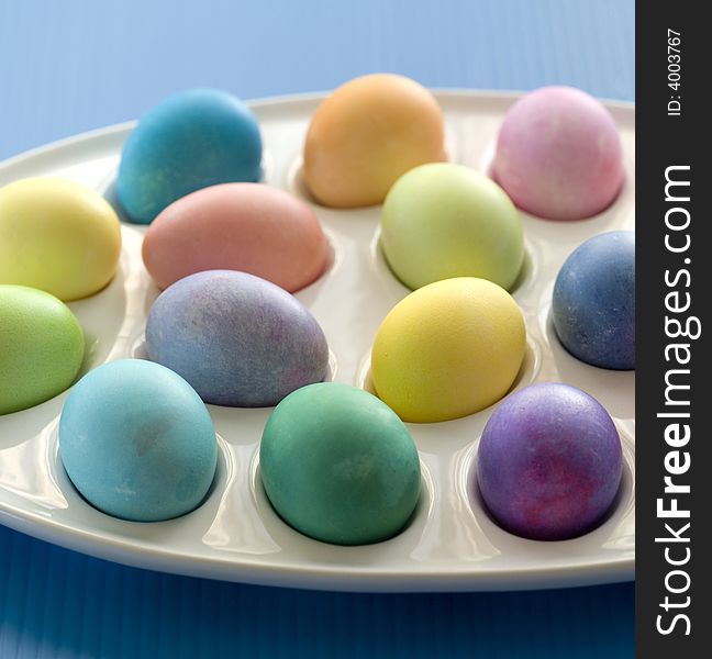 Studio shot of colored easter eggs set on tray. Studio shot of colored easter eggs set on tray