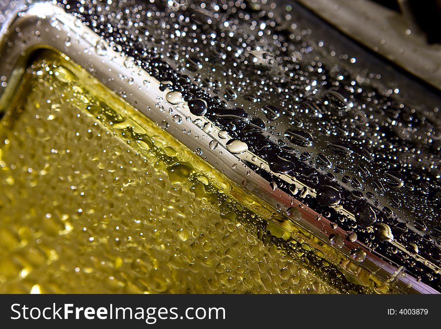 Abstract photo of water drops on a metal bumper. Abstract photo of water drops on a metal bumper
