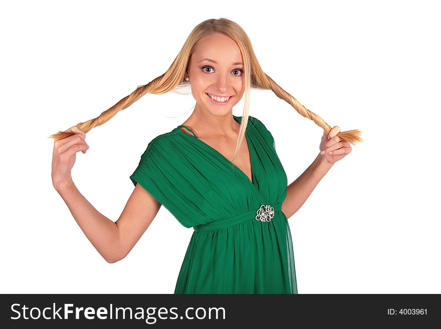 Girl in green holding plaits on white