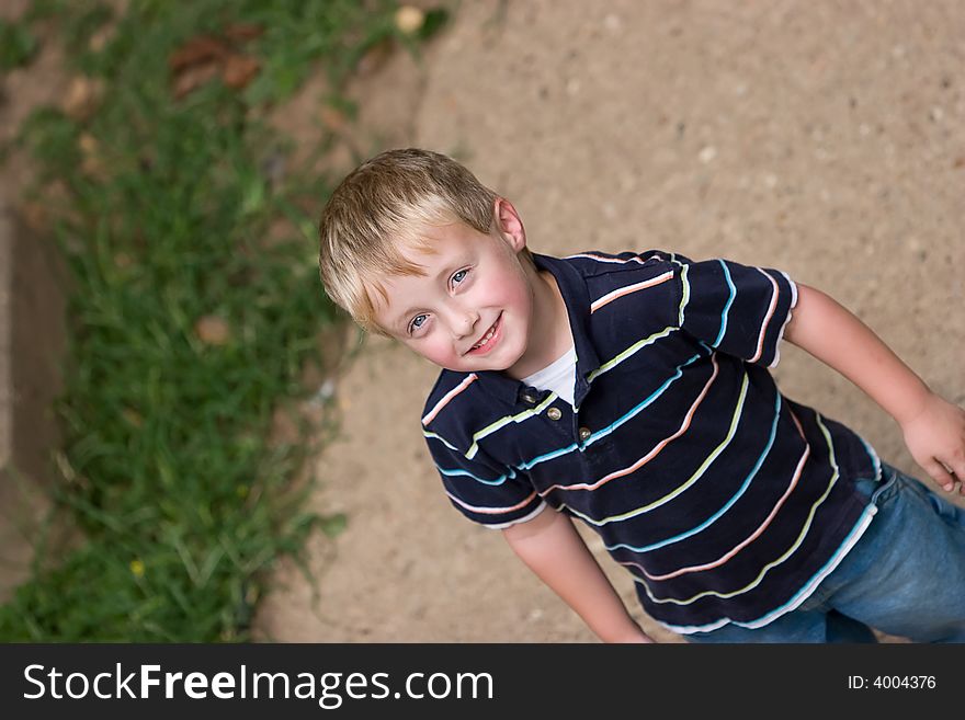 Dynamic photo of preschooler in a colorful stripped shirt. Dynamic photo of preschooler in a colorful stripped shirt.
