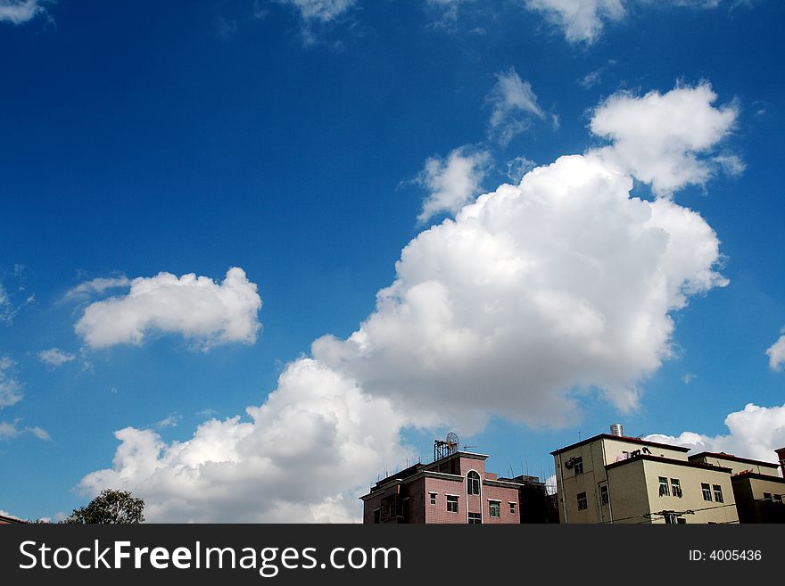 Blue sky with white clouds, a large white clouds floating in the sky.