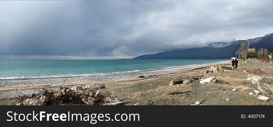 Couple with dog walking on the beach. Couple with dog walking on the beach