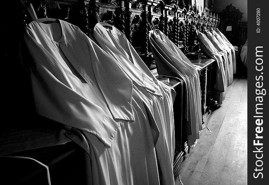 Hanging cassock in the vestry in an old church. Hanging cassock in the vestry in an old church