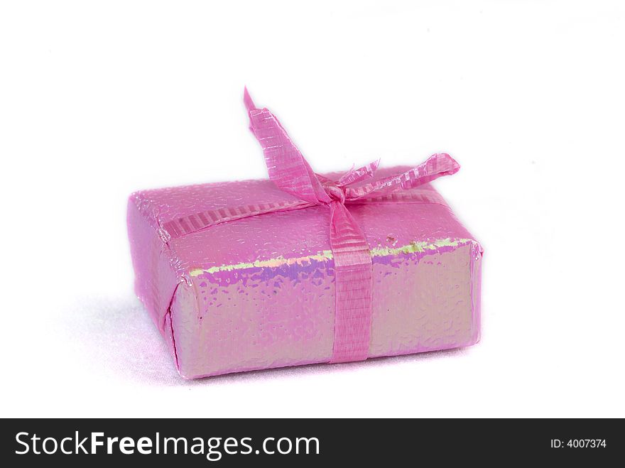 Pink color gift present box with ribbon