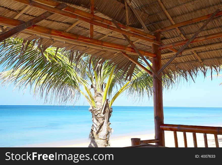 View of nice exotic bamboo hut on tropical beach. View of nice exotic bamboo hut on tropical beach