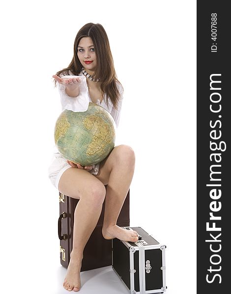 Young woman with  suitcase and globe on  isolated background