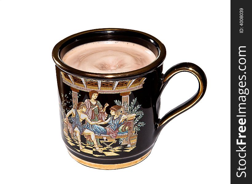 A decorated coffee mug filled to the brim with coffee. A decorated coffee mug filled to the brim with coffee