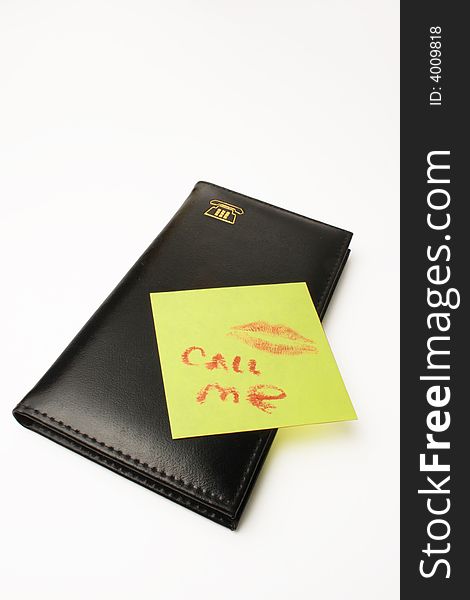 The telephone book and note with lips imprintimprint