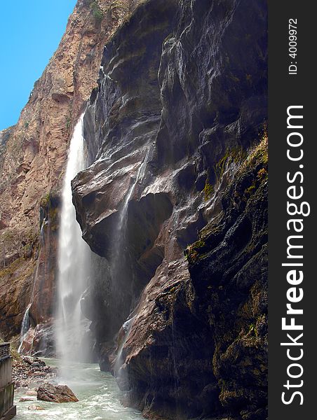 Waterfall in mountains of Caucasus