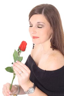 Brunette Beauty Smelling A Rose Royalty Free Stock Photos
