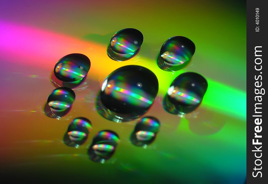 Macro picture of water drops on a cd disc.