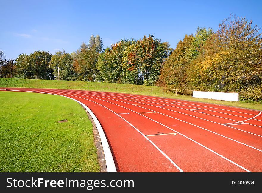 Runners racetrack going left, surrounded by trees. Runners racetrack going left, surrounded by trees