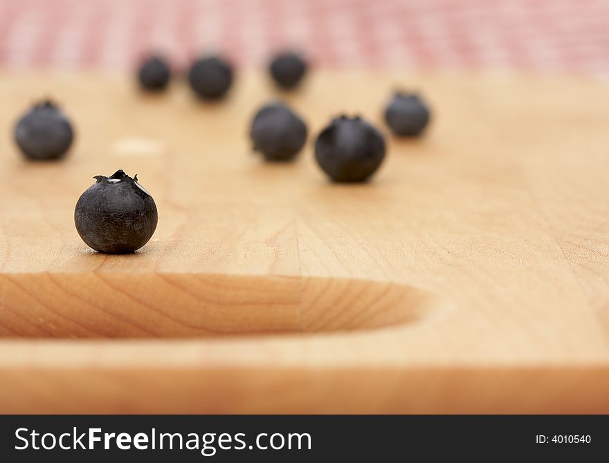 Blueberries on a Cutting Board with Narrow Depth of Field - red & white checkered gingham