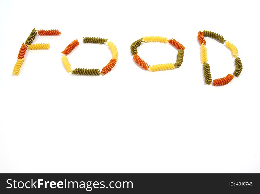 Spiral pasta on white background creates the word FOOD. Spiral pasta on white background creates the word FOOD