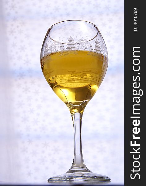 Golden wine in glass from very low perspective. Golden wine in glass from very low perspective