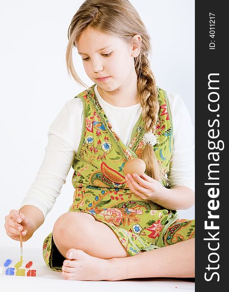 Young Girl Painting Eggs For Easter