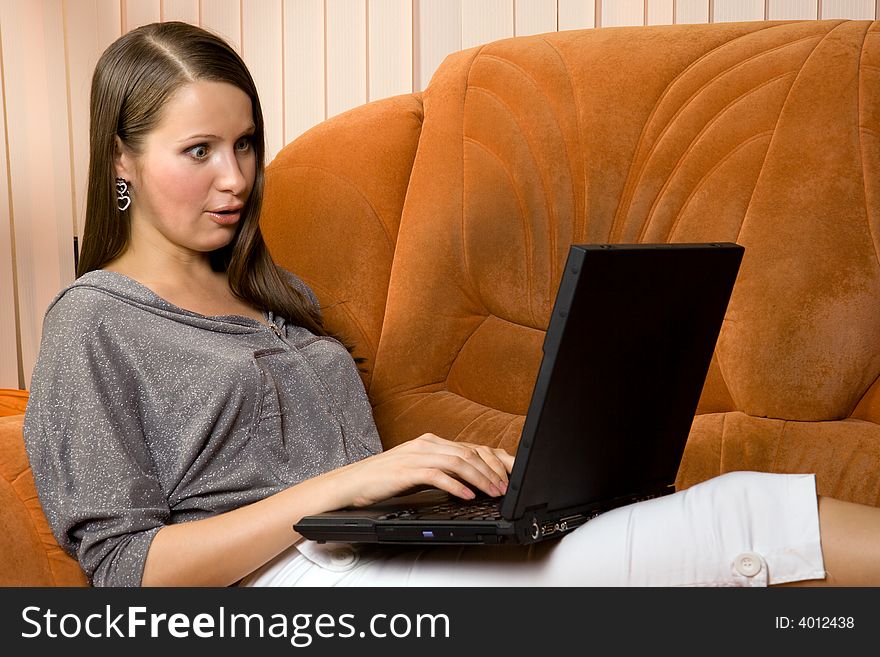 Young women working at laptop