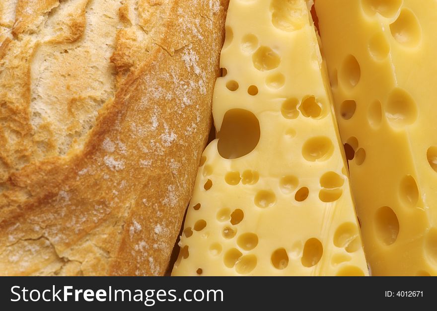 Fresh baguette and cheese background