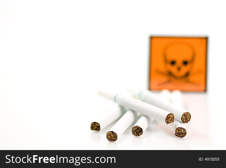 Cigarets and skull on white background
