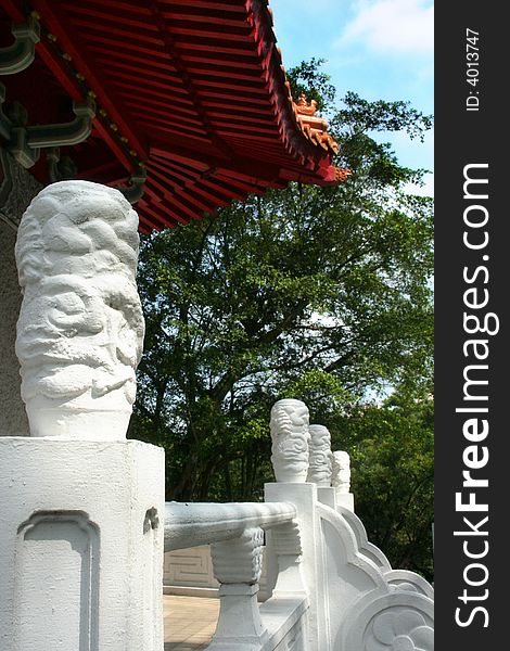 An old japanese architecture ceiling and entrance statues. An old japanese architecture ceiling and entrance statues