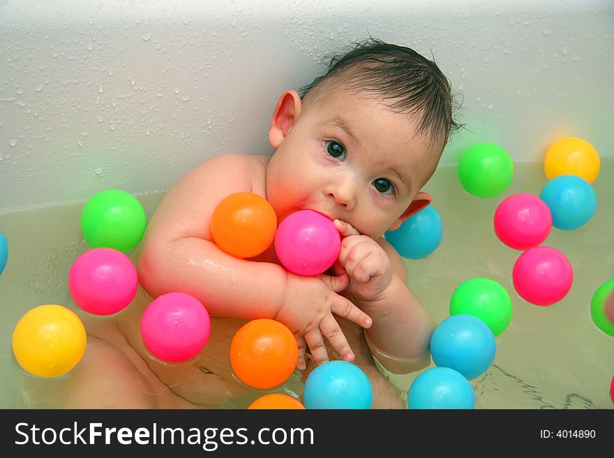 The Child Bathing In A Bath