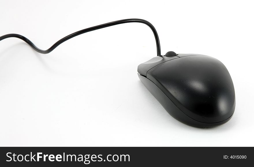 A black computer mouse isolated on a white background. A black computer mouse isolated on a white background.