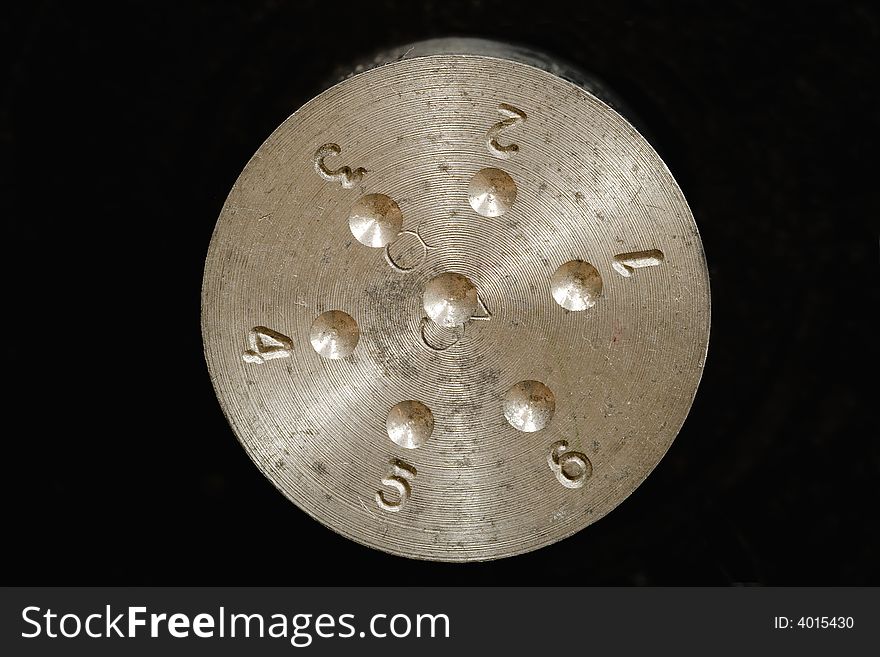 Macro shot of aluminium surface with numbers. Macro shot of aluminium surface with numbers