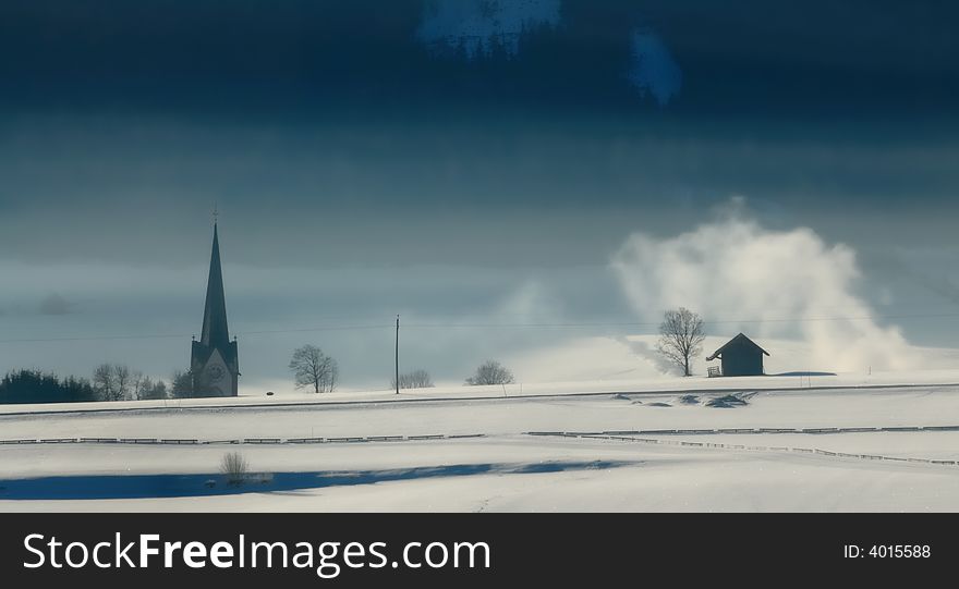 Winter landscape with spire of a church. Winter landscape with spire of a church