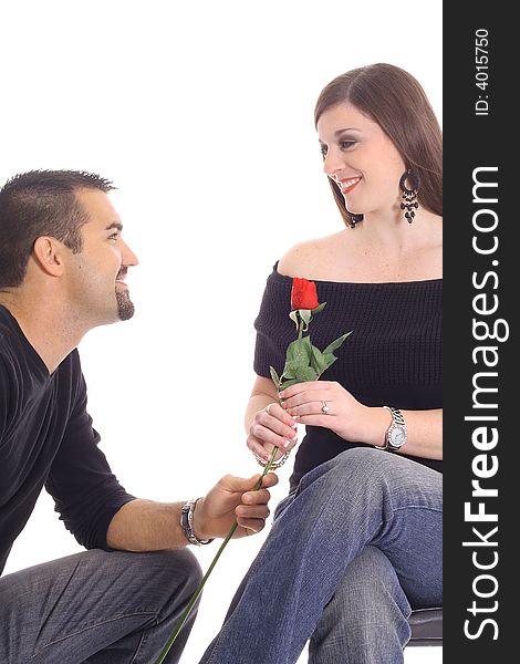Man giving woman a rose isolated on white