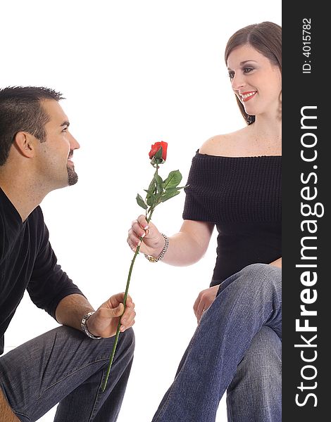Latino man giving woman a rose isolated on white