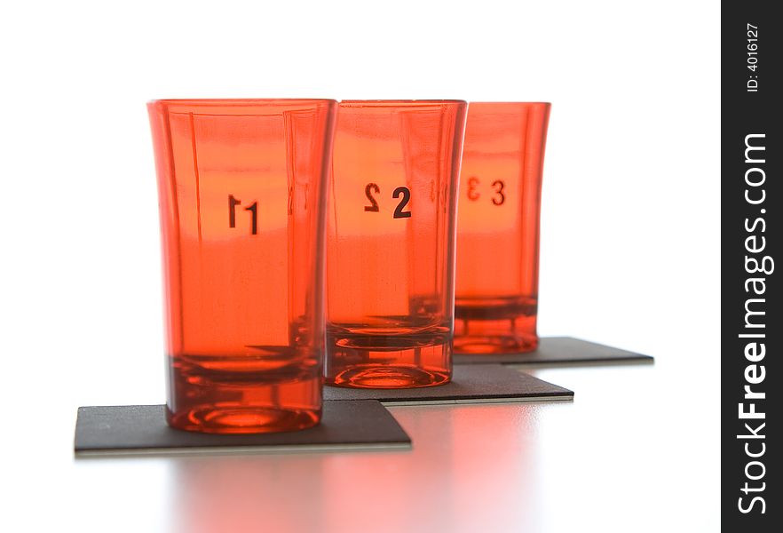 Three red glass glasses with focus on figure 2