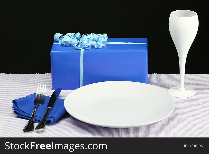 A festive dinner table with wine an presents. A festive dinner table with wine an presents