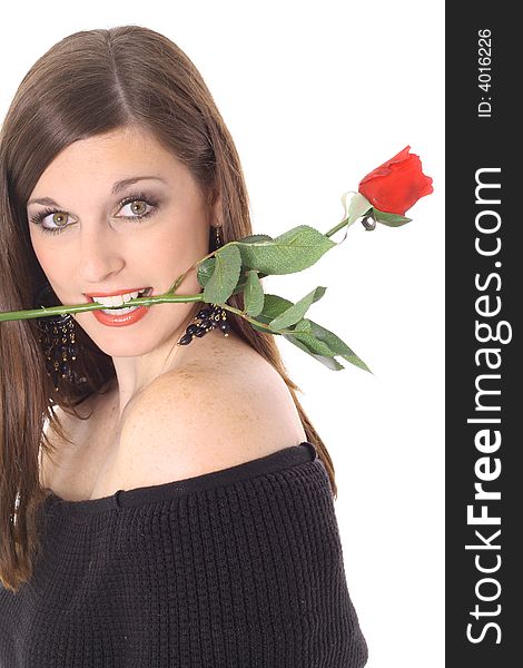 Brunette with a rose in her mouth isolated on white