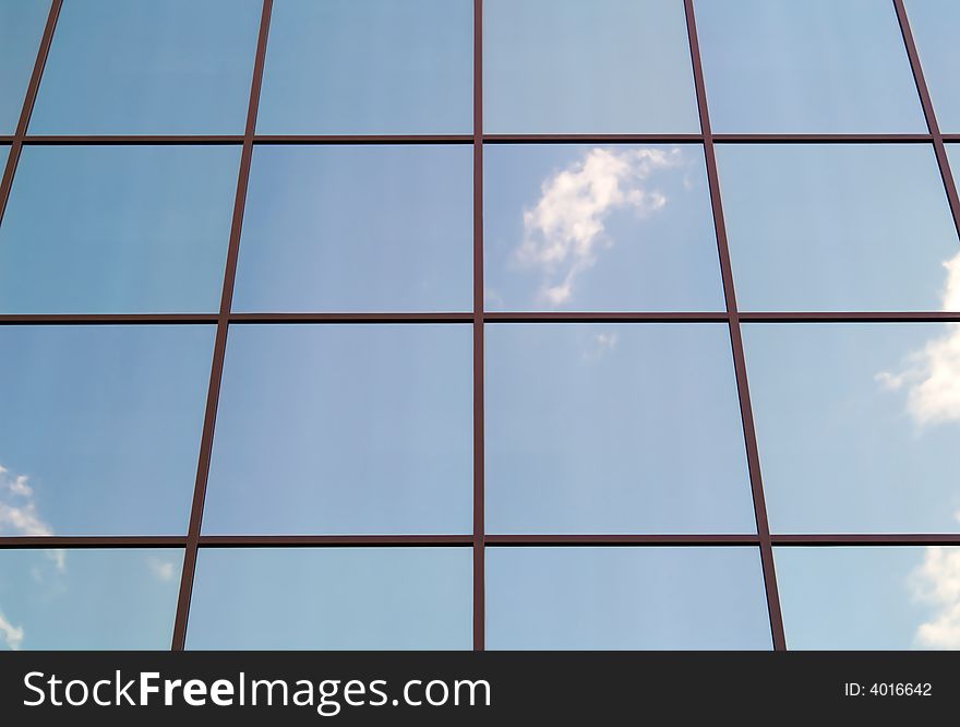 Blue office windows with clouds mirror. Blue office windows with clouds mirror